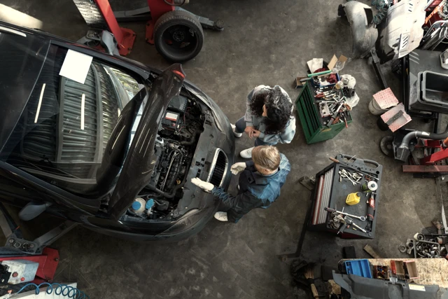 A group of mechanics working in the vehicle